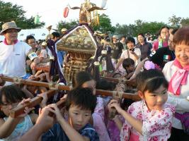 Children carrying a portable shrine